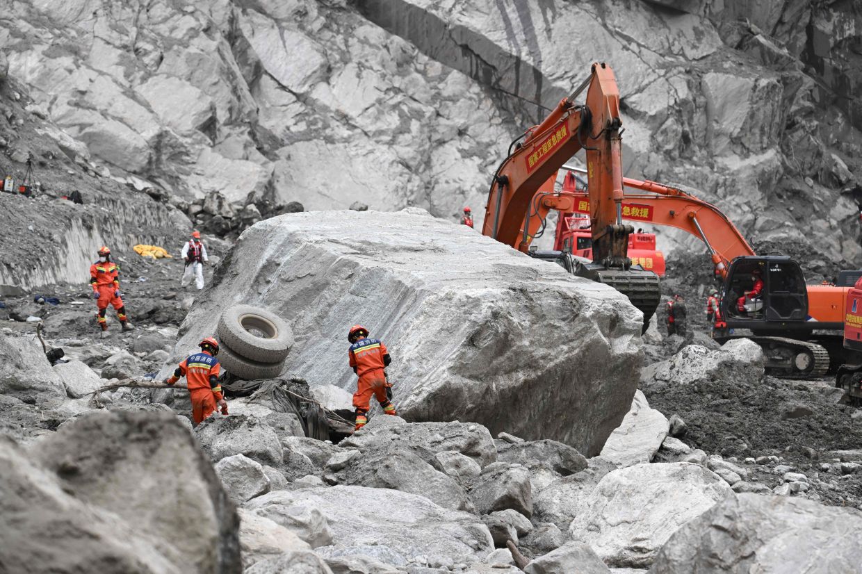 Rescue personnel search through the debris left by a mudslide in the area around the destroyed Gyirong Port in Gyirong County, in China's western Tibet region on Sept 2, 2026. - Photo: AFP