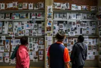 Nepalis pin hopes on 'wall of the missing' in hunt for relatives after deadly flood