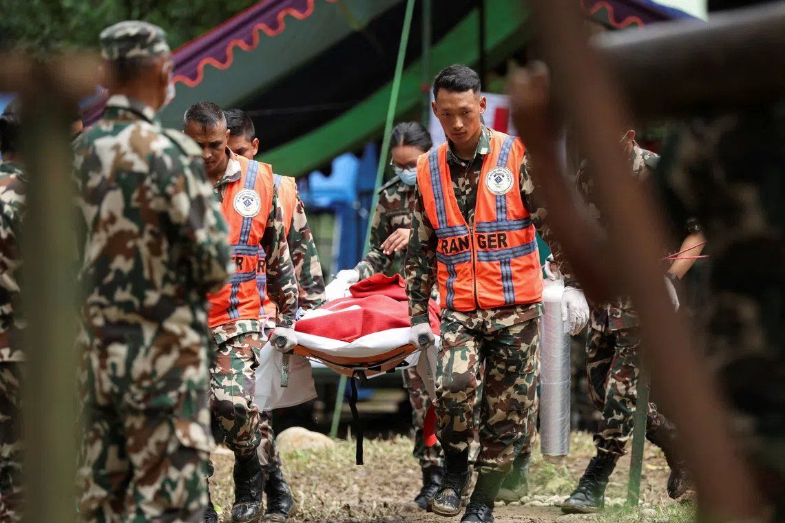 Sanjay Sah, a survivor rescued from a tunnel of the Upper Trishuli 3A hydropower project nine days after the deadly flash floods and a mudslide, is carried to be air lifted to Kathmandu from an army base in Nuwakot, Nepal, September 4, 2026. - Photo: Reuters