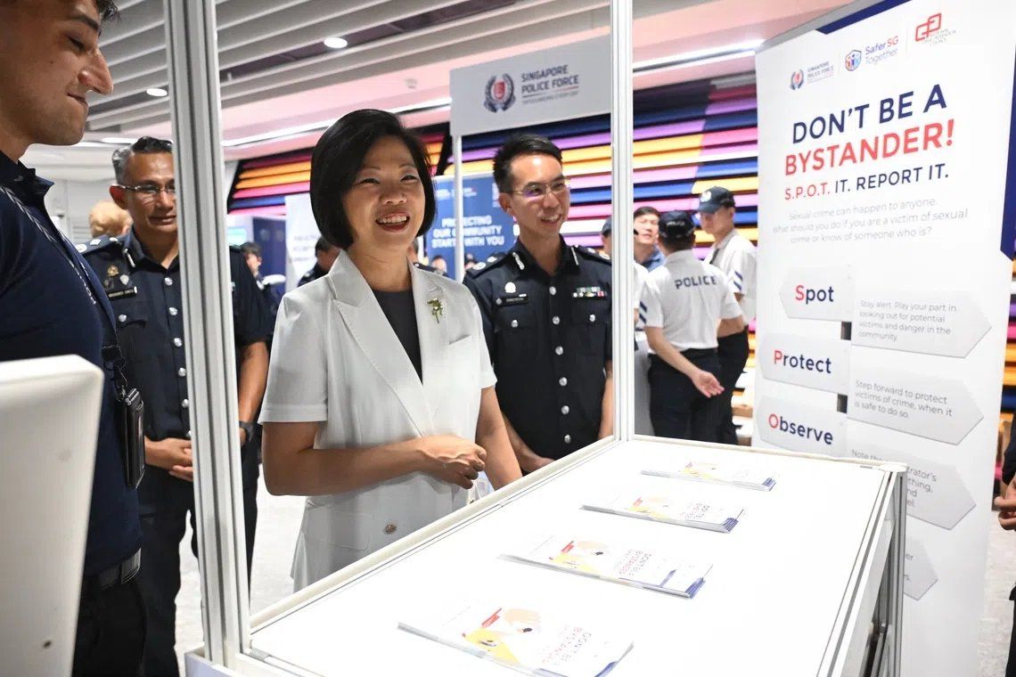 Sim Ann, Second Minister for Home Affairs and Foreign Affairs, touring the Public Transport Security Command Community Roadshow on Sept 4. - Photo: ST