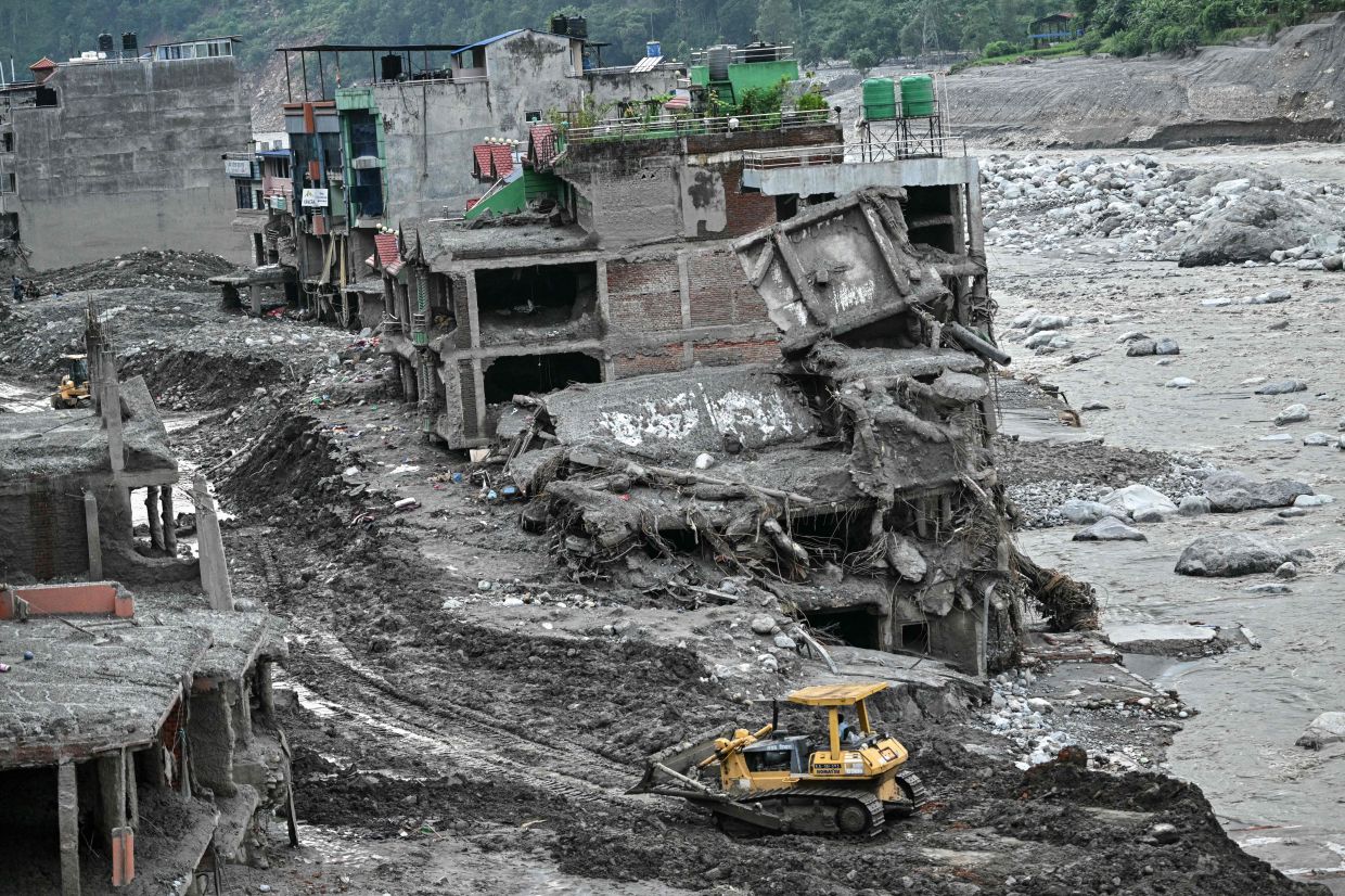 A general view shows damaged houses covered in sludge in the aftermath of flash floods in Trishuli, Nepal's Nuwakot district on September 4, 2026. Devastating floods on the China-Nepal border have killed at least 1,287 people in Nepal, the disaster authority said September 4, with the number of missing at 5,083. - Photo: AFP