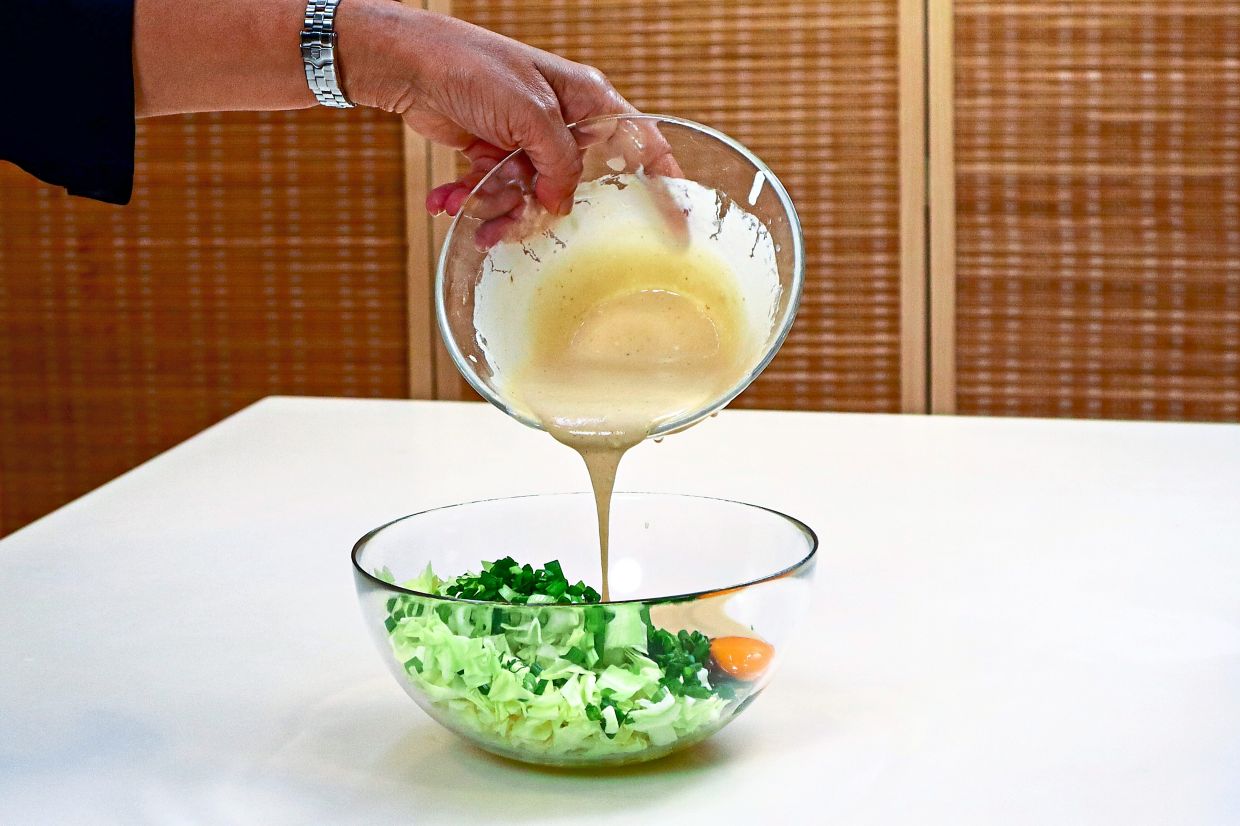 Osaka-style pancakes has the ingredients mixed in a bowl (above) before cooking in a hot pan (below).