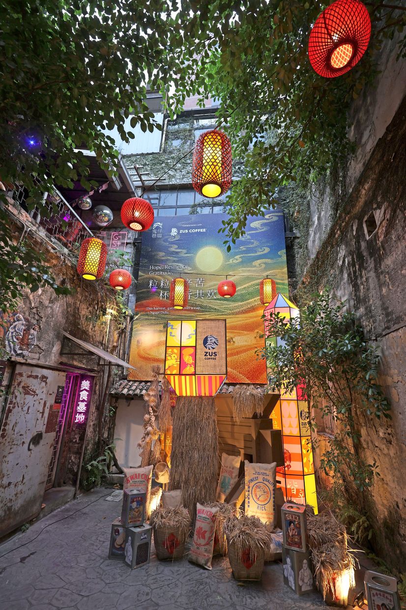 The Harvest Pavilion depicting the journey of padi through a traditional rice mill before being packed into sacks.