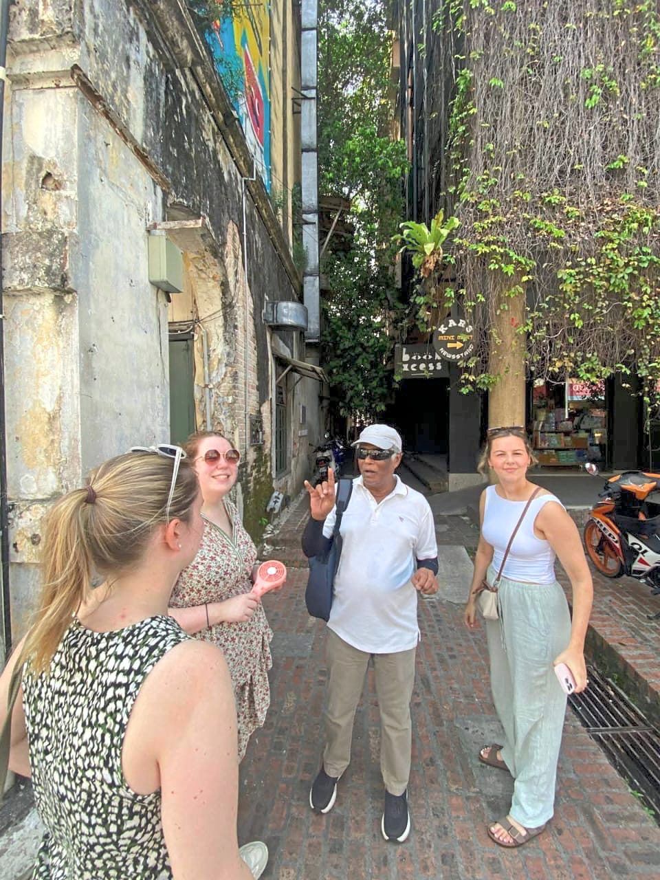 Heritage walk: Sundralingam regaling visitors on his guided tour in Ipoh. — Photo courtesy of S. Sundralingam