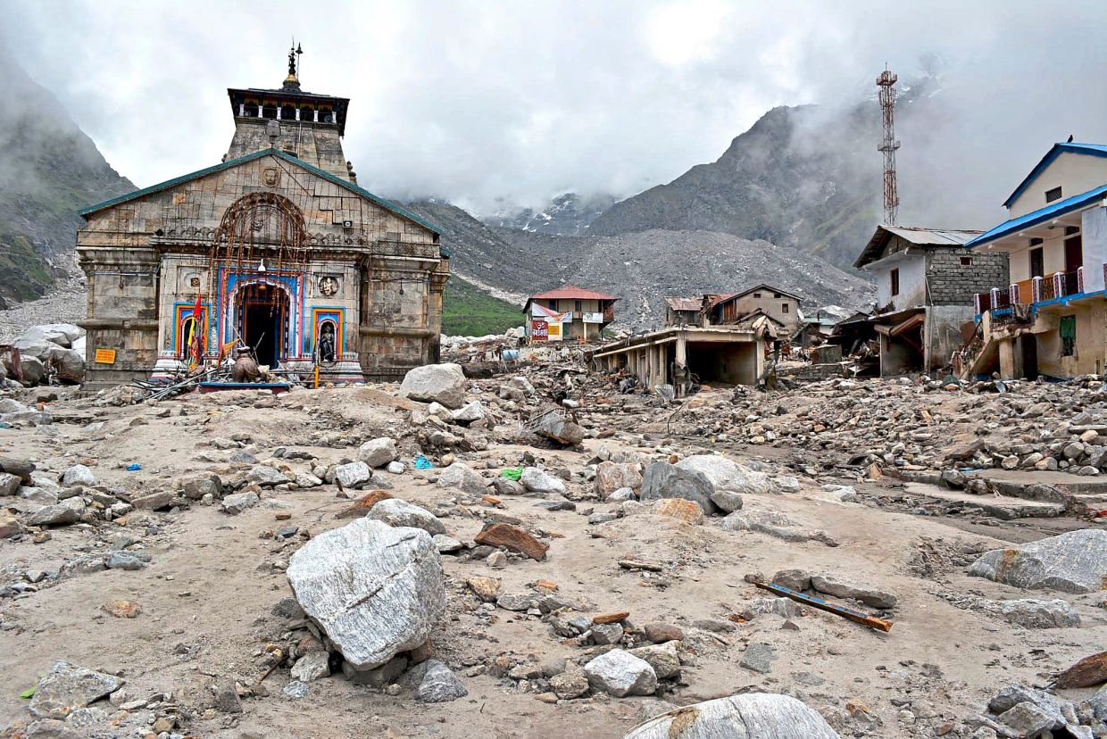 In this 2013 photo, the Kedarnath shrine and other buildings around it are seen damaged following monsoon rains in northern India.