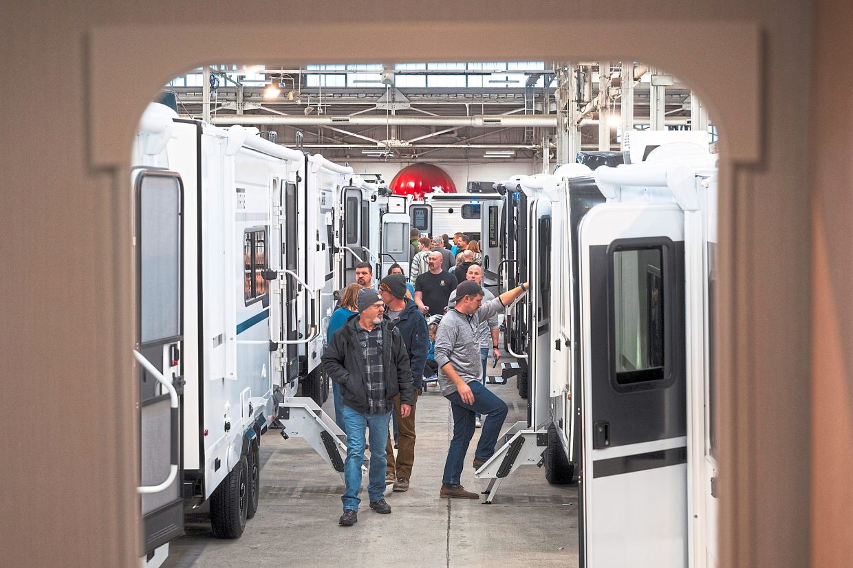 Attendees tour travel trailers at the Indy RV Expo in Indianapolis.