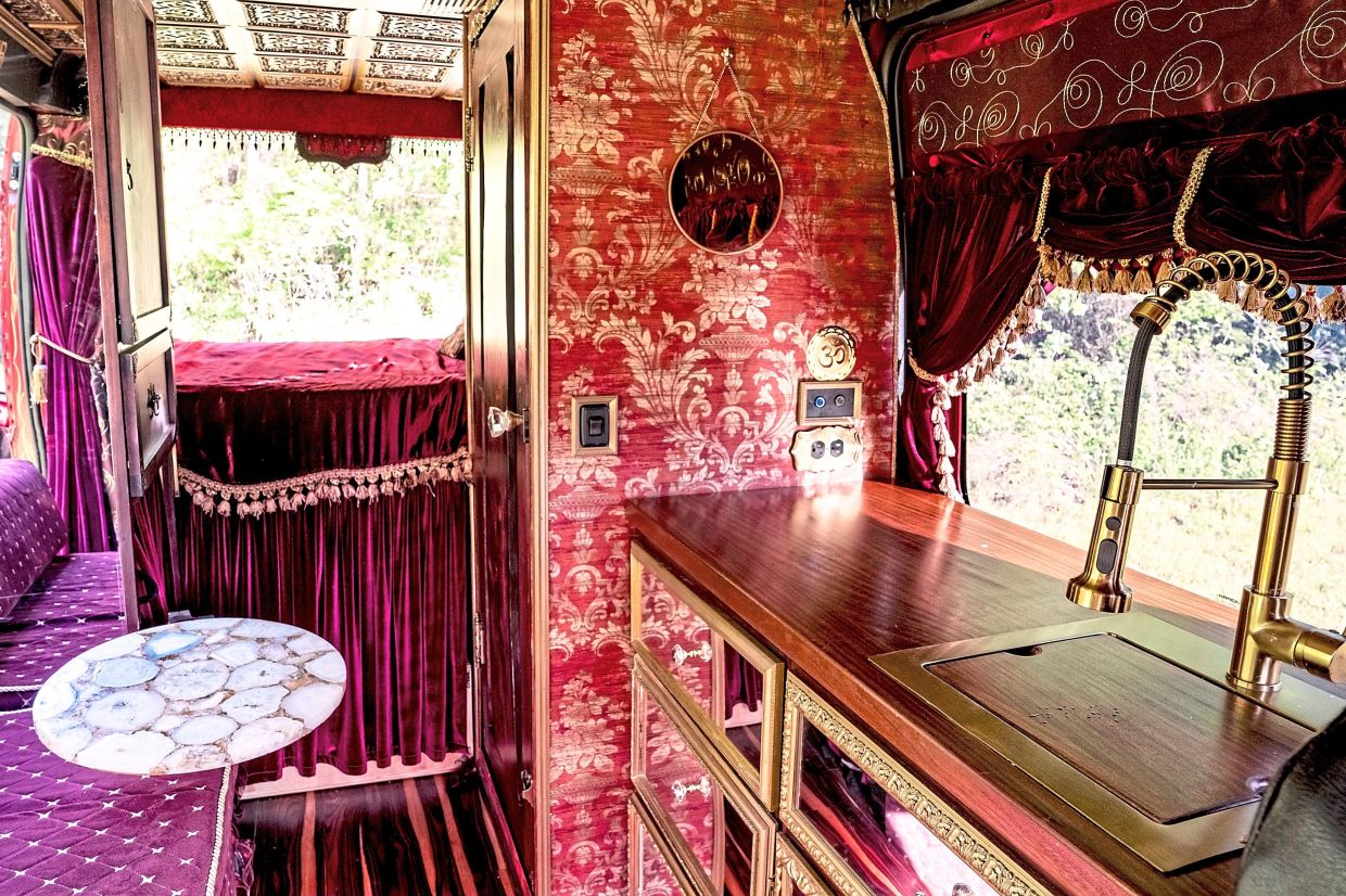 The inside of Brown’s camper van, which was inspired by her vehicle’s scarlet exterior. — WHITNEY CURTIS/The New York Times