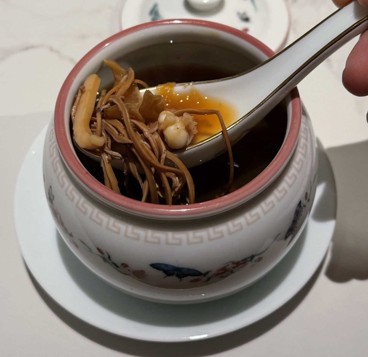 The Jungle Garlic Black Chicken Soup features oil extracted from kulim. — MICHAEL CHEANG/The Star