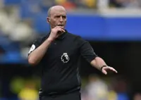 Soccer-Former referee Dean defends integrity after backlash over playing 'games' during matches