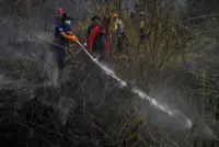 Indonesia conducts water bombing to contain wildfires near future capital