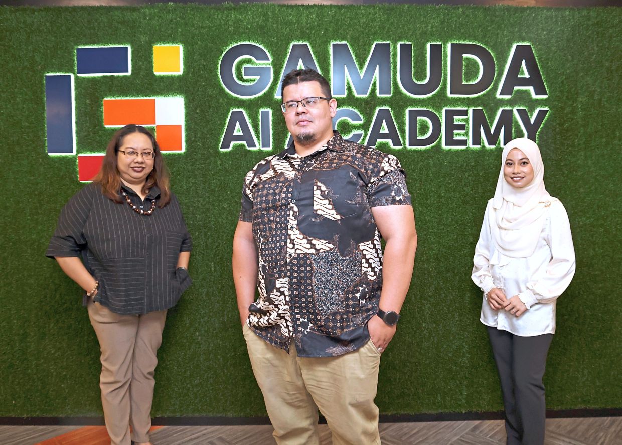 (From left) Raina, James and Sarah went on to forge new career paths after graduating from the Gamuda AI Academy. — ART CHEN/The Star