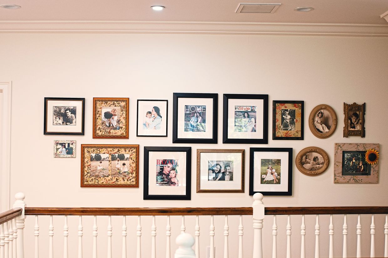 Family photos line a wall in MacDowell's home.