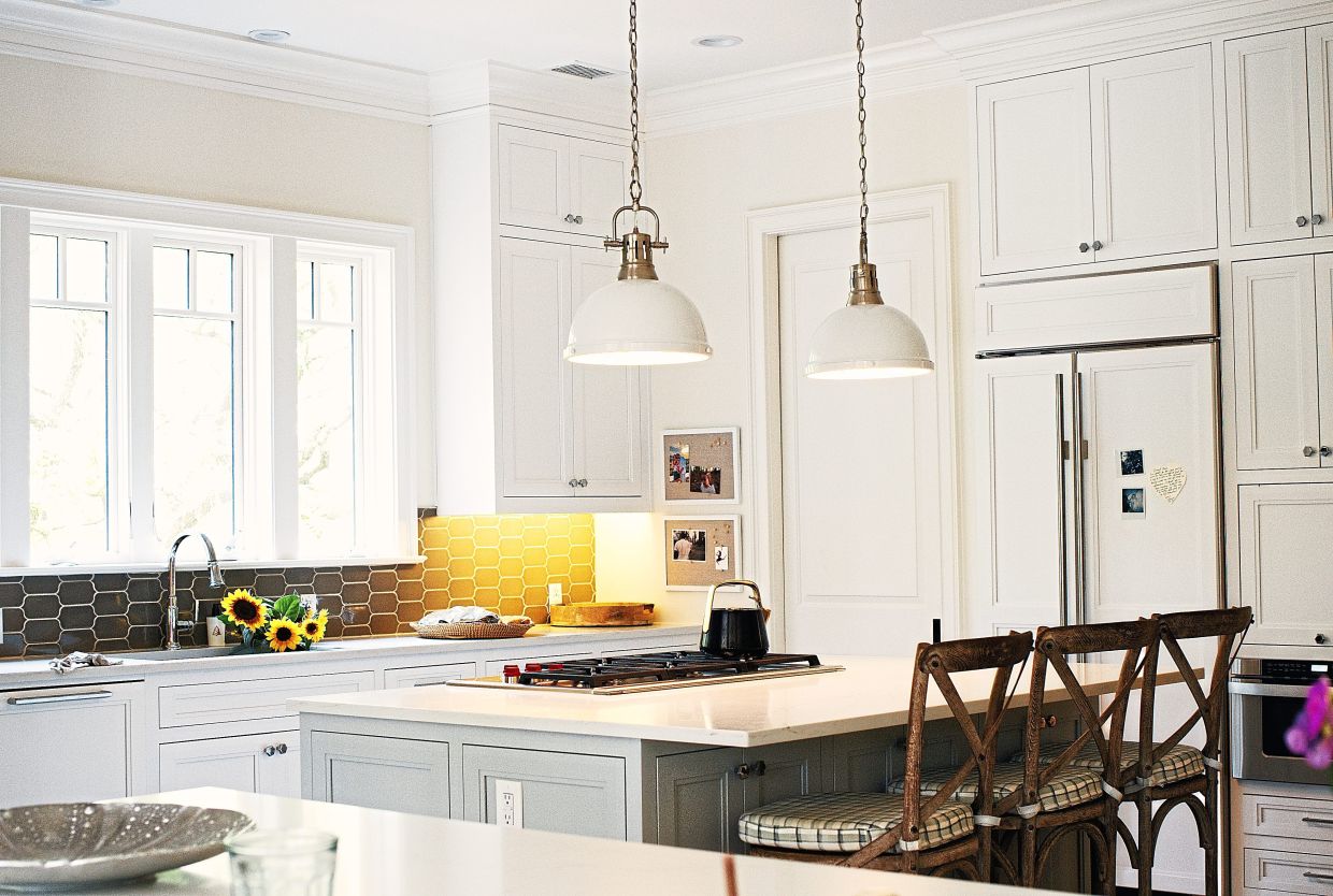 MacDowell mostly left the kitchen alone when she moved in, but got rid of the cherry wood planks that were there, exchanging them for a diamond pattern of sandy brown and off-white.