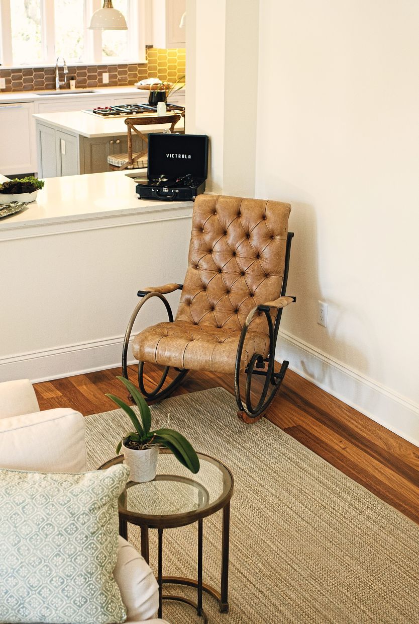 The tufted rocking chair in which MacDowell rocks her grandchildren.