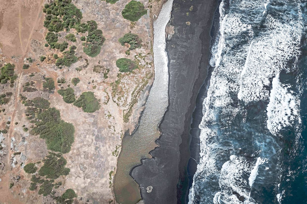 An aerial view of Praia de Areia Grande, where sand mining was halted by authorities, near Pedra Badejo.