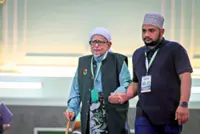 PAS softens stance for unity