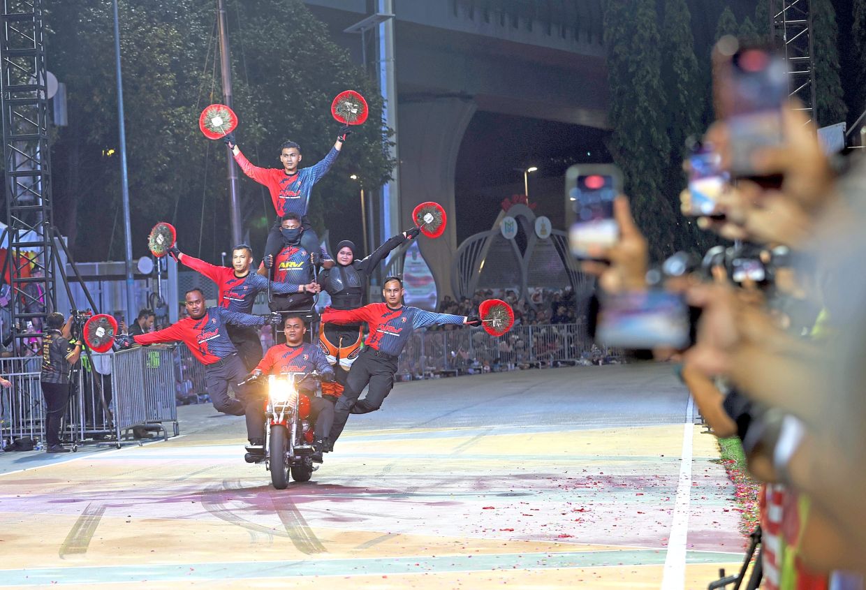 Malaysia’s armed forces also displayed their prowess, including motorcycle tricks.—CHAN TAK KONG/The Star
