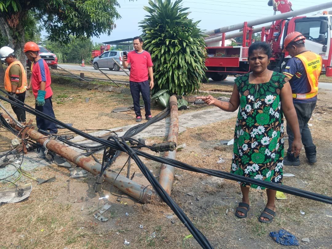 C. Veronica showing the electric pole that fell after a lorry crashed into a rented house.