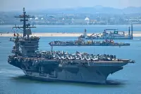 US aircraft carrier concludes port call
