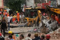 Six killed in Delhi building collapse, rescuers search through rubble