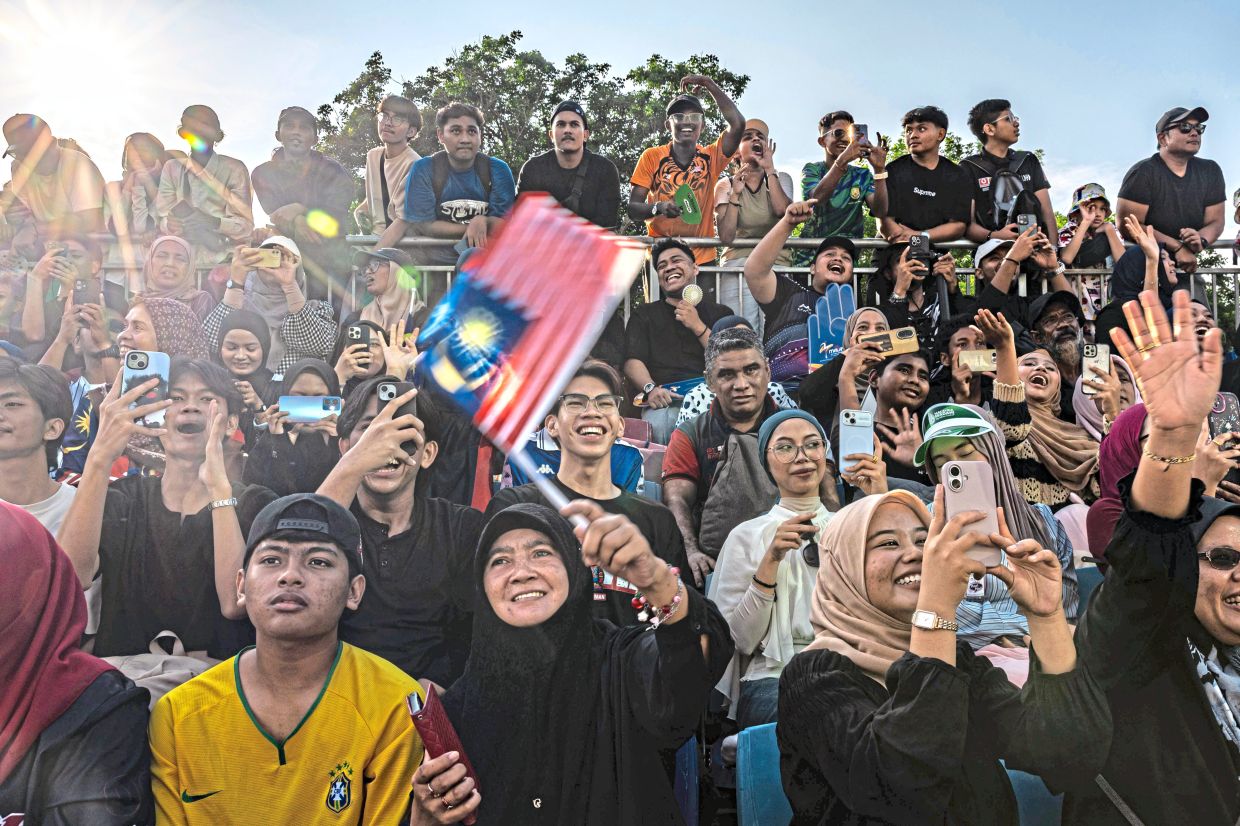 Visitors capture picture-perfect moments during the 2026 National Day celebration at Anjung Floria.