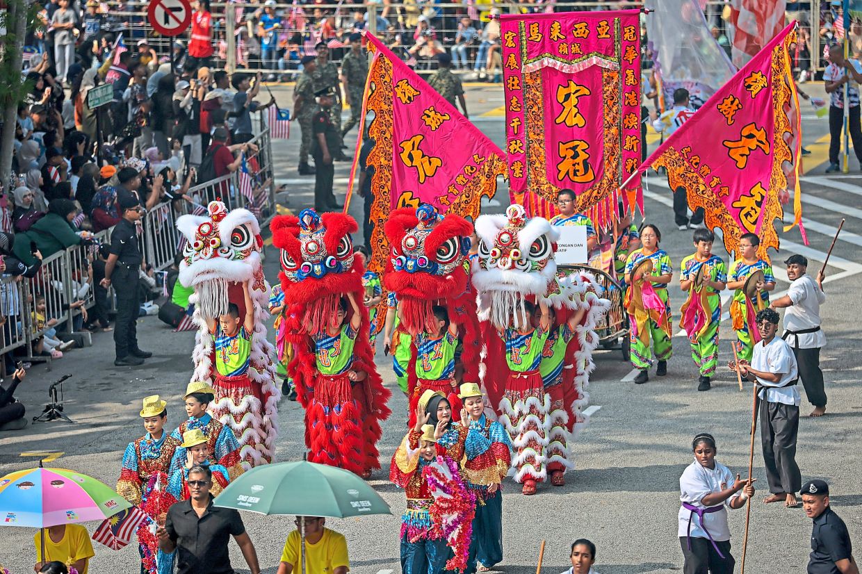 A lion dance troupe adds a burst of colour and tradition to the parade and procession held in conjunction with Penang’s 2026 National Day celebration at Padang Kota Lama in George Town.