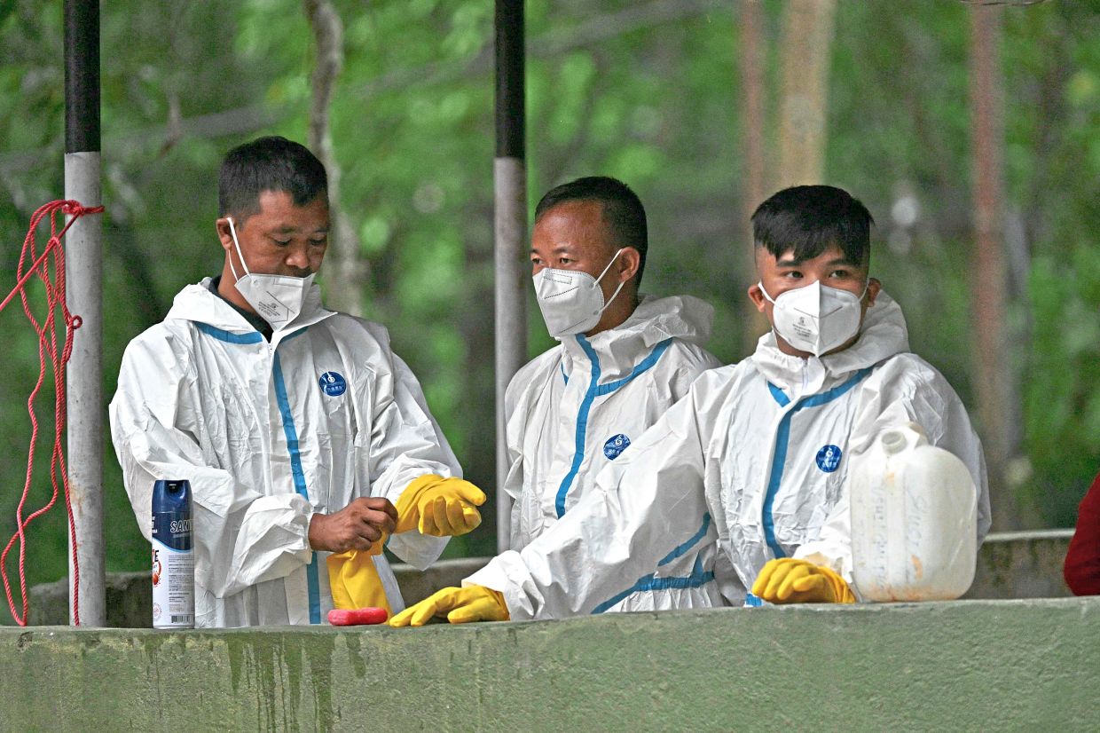 7. Forensic personnel inside a temporary relief camp following the deadly flash floods in Trishuli. — AFP