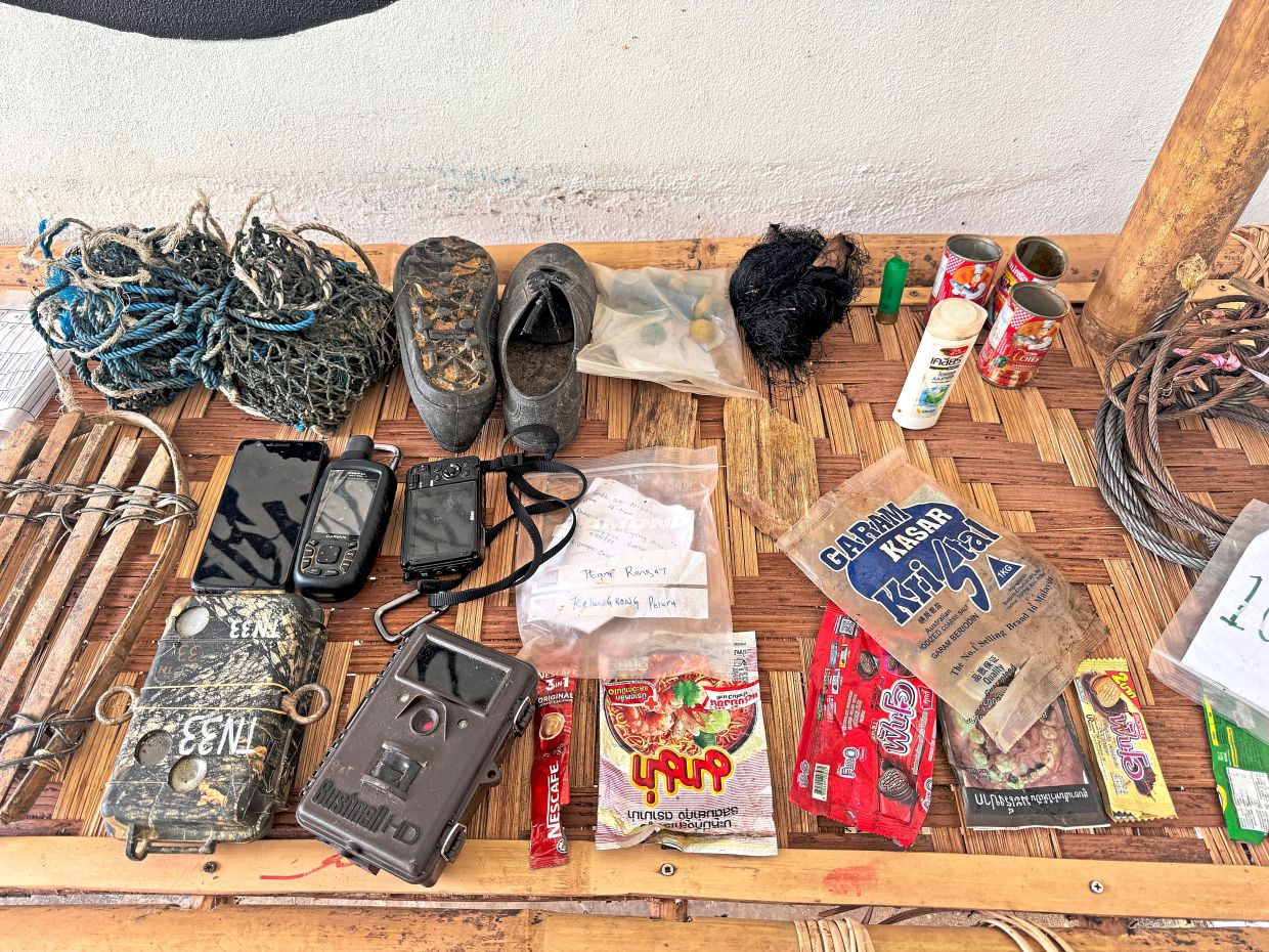 Some broken equipment and waste recovered from inside Belum-Temenggor, believed to have been left behind by poachers.
