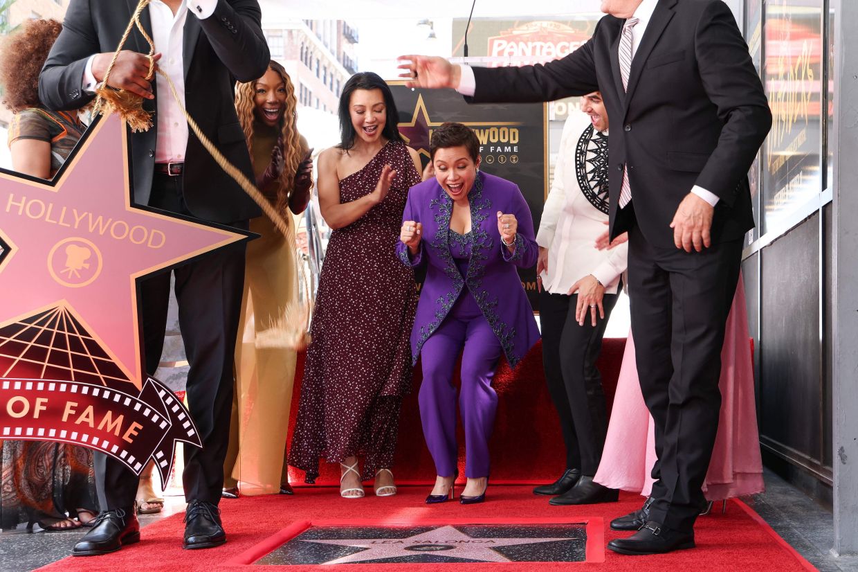 Lea Salonga reacts as her star is unveiled. Photo: AFP