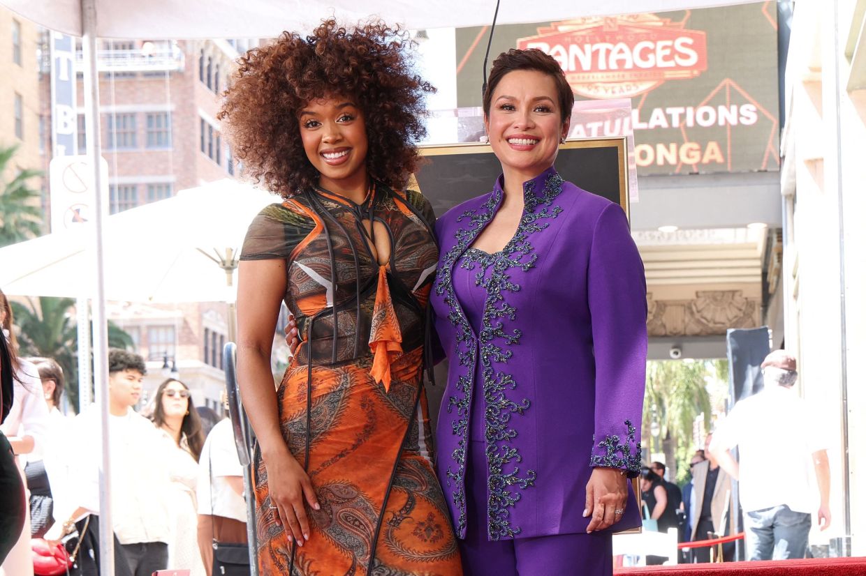 Lea Salonga with US-Filipino R&B singer-songwriter H.E.R. Photo: AFP