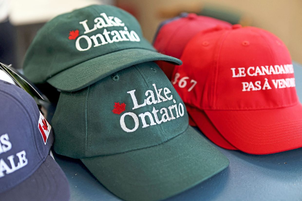 Caps printed with ‘Lake Ontario’ on display in Ottawa, Canada. Trump recently ordered the US government to change the name of border-spanning Lake Ontario to ‘Lake America’. — AFP