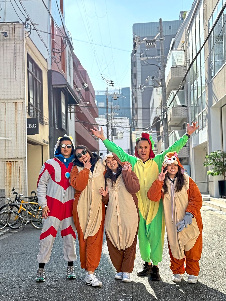 Despite living with tics, Chew (second from right) makes the most of life.