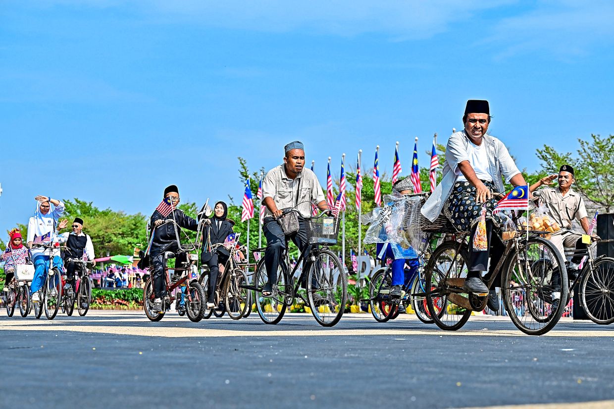 Vintage bicycle owners join the National Day 2026 parade at Dataran Shahbandar in Kuala Terengganu. Around 10,000 visitors lined the streets from early morning to watch the National Day procession, which featured 3,500 participants.