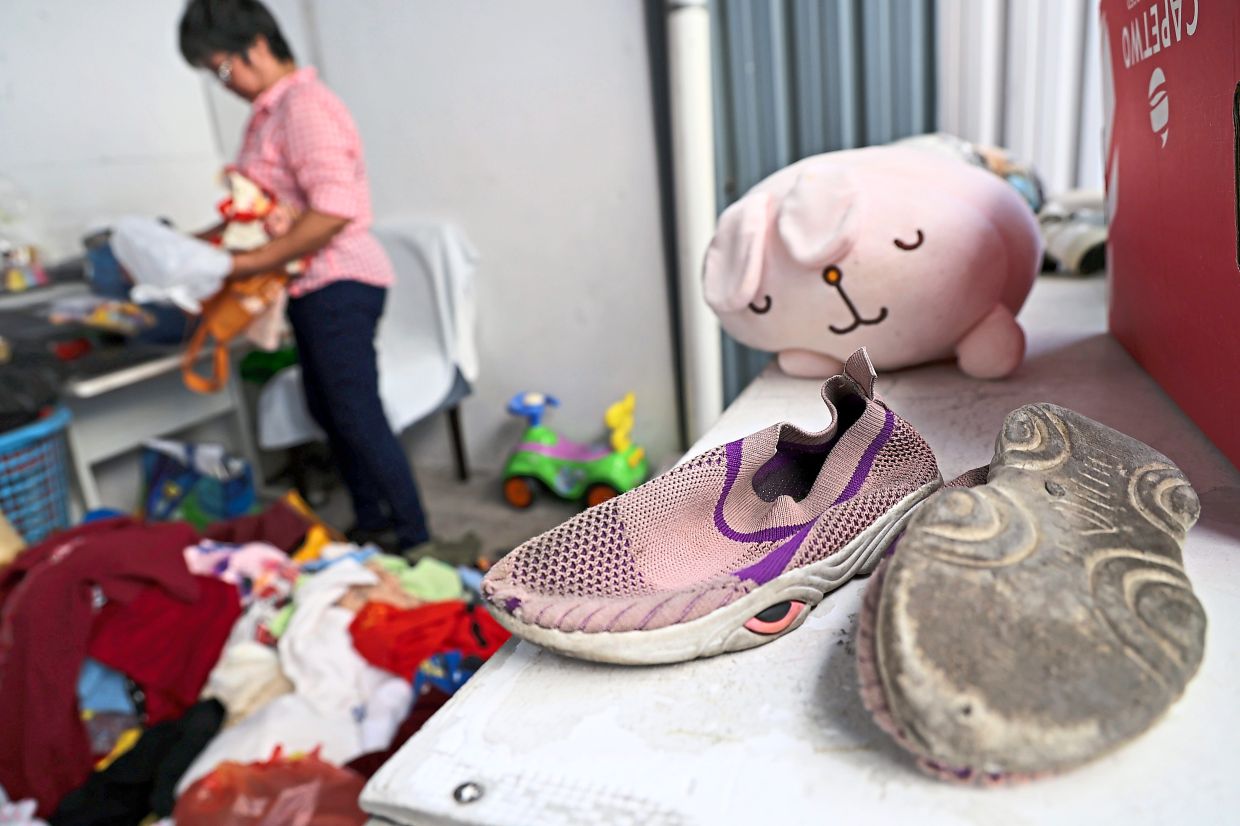 Worn-out children’s footwear received at the Lighthouse Thrift Store in Jalan Penang. 
