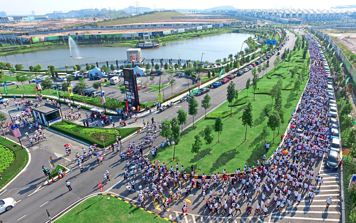 2019: The thousands-strong crowd celebrating Malaysia’s 62nd year of independence during the walk. — GLENN GUAN/The Star