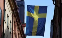 Sweden's Liberals clears parliament threshold in poll, pointing to close election