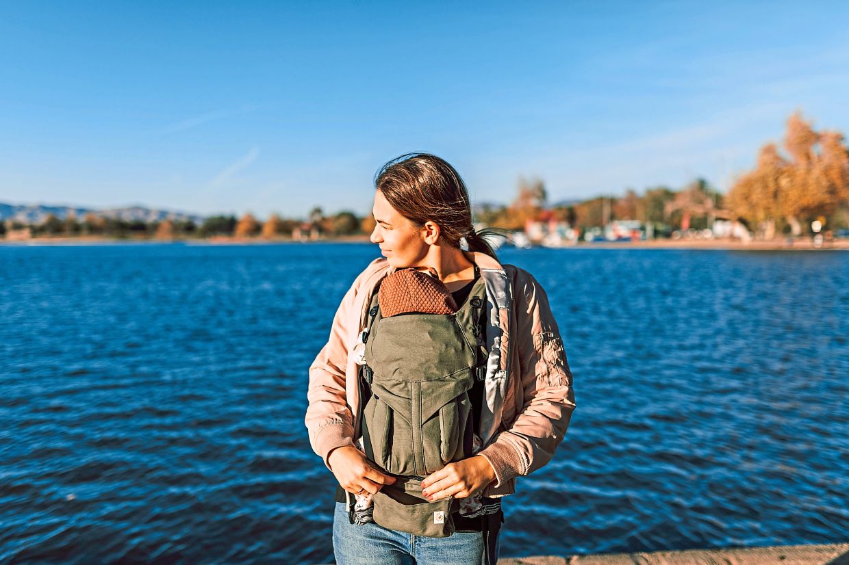 Parents should decide if they want to bring a stroller or use a sling or baby carrier. Photo: Pexels