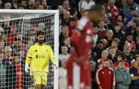 Soccer-Liverpool keeper Becker fined for kicking substitution board after Forest draw