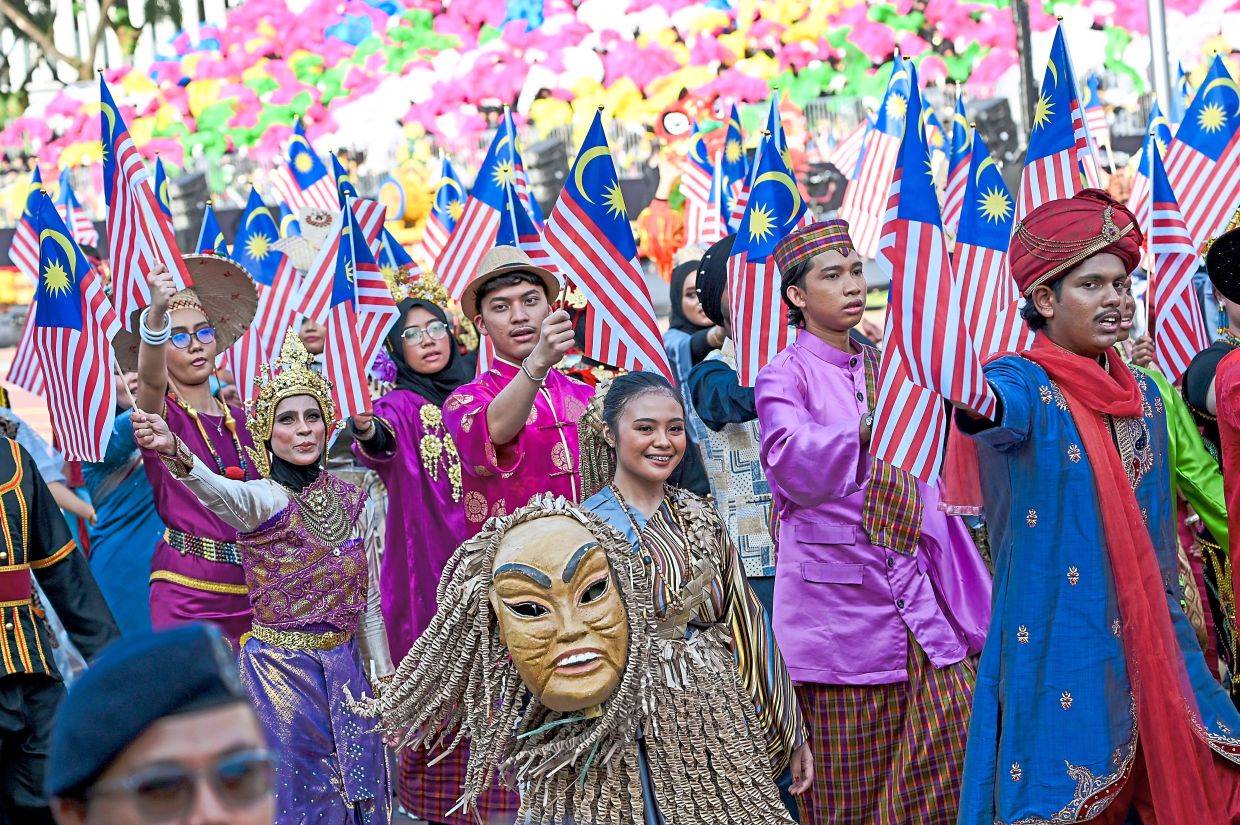 Malaysians in traditional ethnic attire provide colour to the celebration.