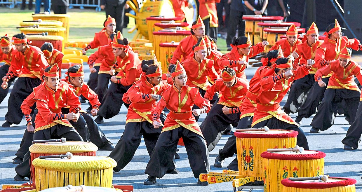 A drum troupe captivates spectators with an energetic performance.