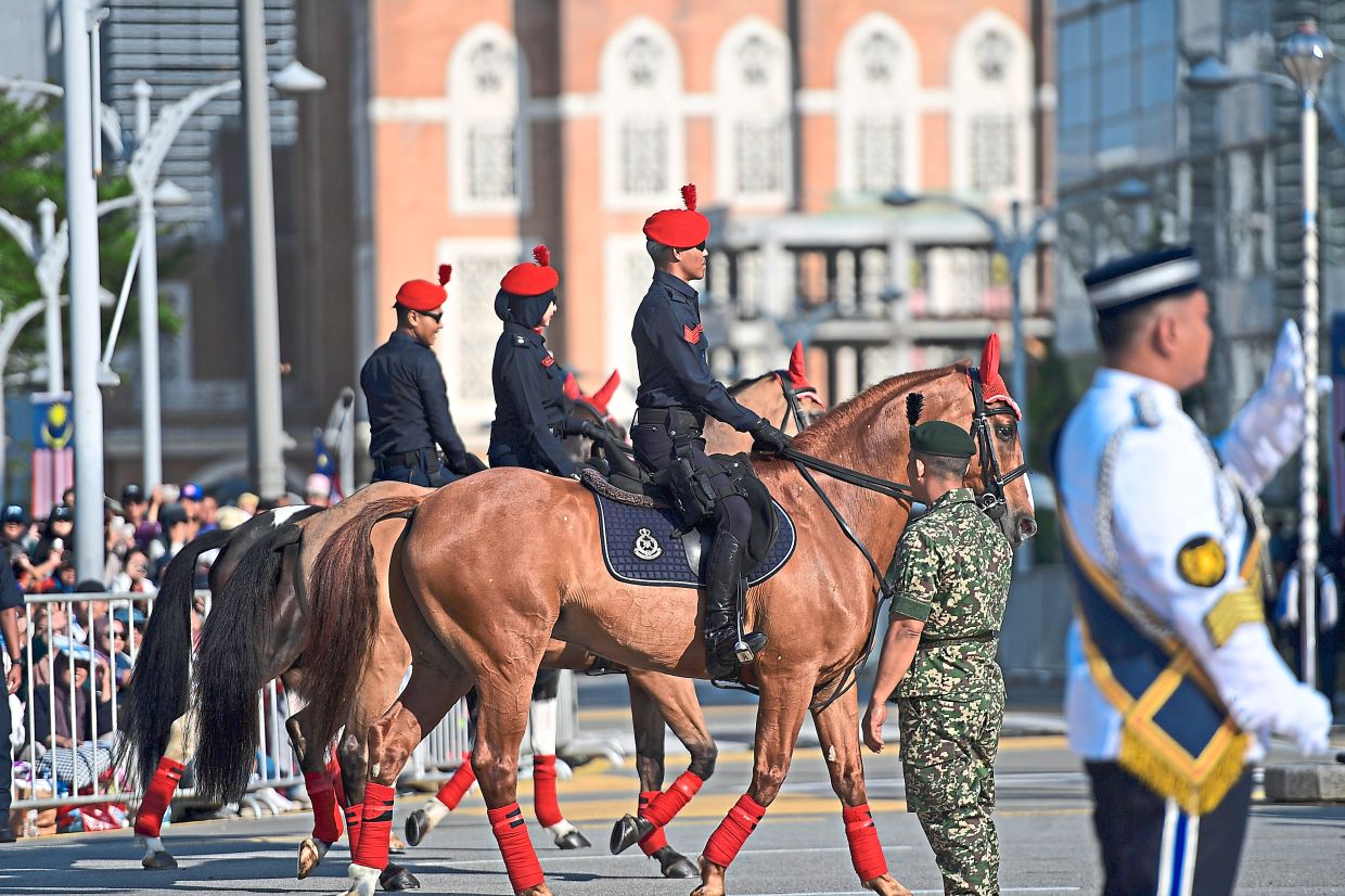 Members of a police mounted unit on parade.