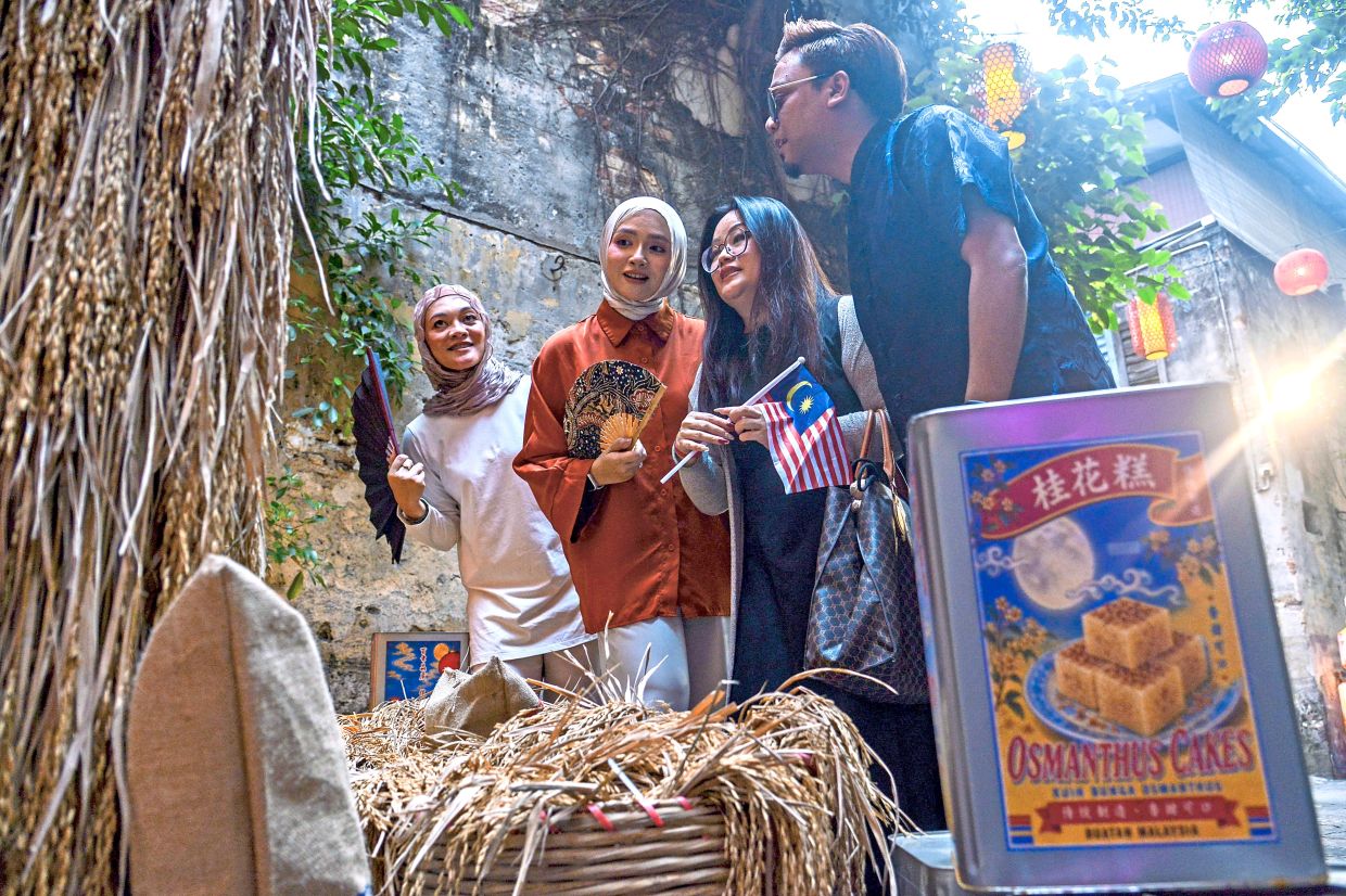Visitors explore the 'Lunar Harvest' installationat Kwai Chai Hong in KL. This year’s Mid-Autumn Festival exhibit reflects on the traditional values of the rice harvest season. Photo: Bernama