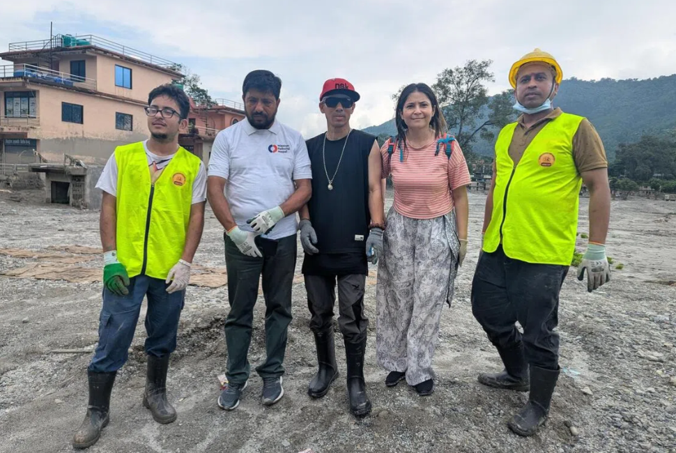 Rapper Nirnaya Shreshta (in black), flanked by retired policeman CP Gautam (in white) and upcycling entrepreneur Prakriti Mainali. They gathered 80 volunteers from Kathmandu to clear silt from flood-affected towns like Devighat in Nepal. - ST/ROHINI MOHAN
