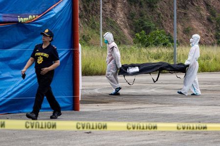 Philippines begins identifying victims from ferry fire as dozens still missing