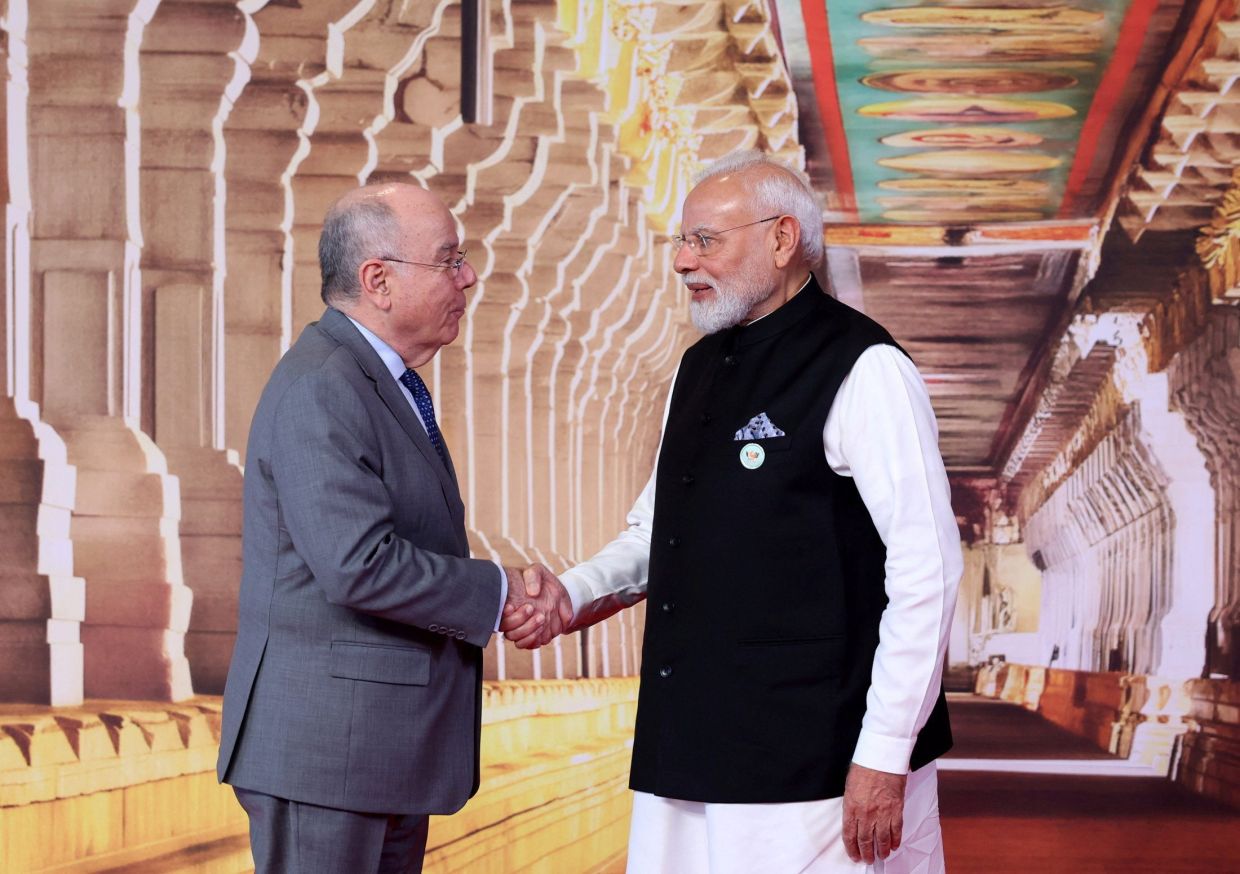 India’s Prime Minister Narendra Modi shakes hands with Brazil’s Foreign Minister Mauro Vieira at Bharat Mandapam, the venue of BRICS Summit in New Delhi, India, on Saturday, September 12, 2026. -- India's Press Information Bureau/Handout via REUTERS