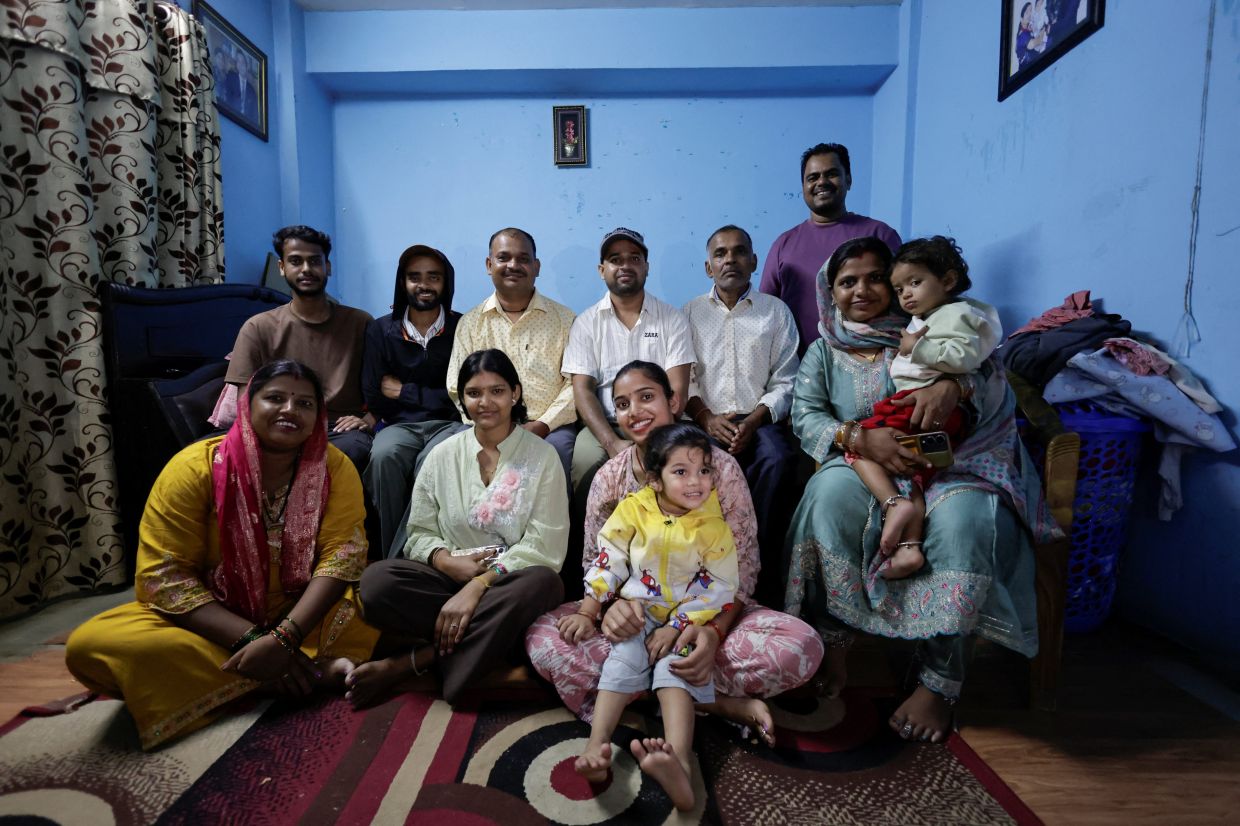 Sanjay Sah, a survivor pulled out alive after spending nine days trapped in a hydropower station tunnel following flash floods and a mudslide, pose for a picture along with his family members at his sister's rented apartment after being discharged from the army hospital in Kathmandu, Nepal, Sept 11, 2026. - Photo: Reuters