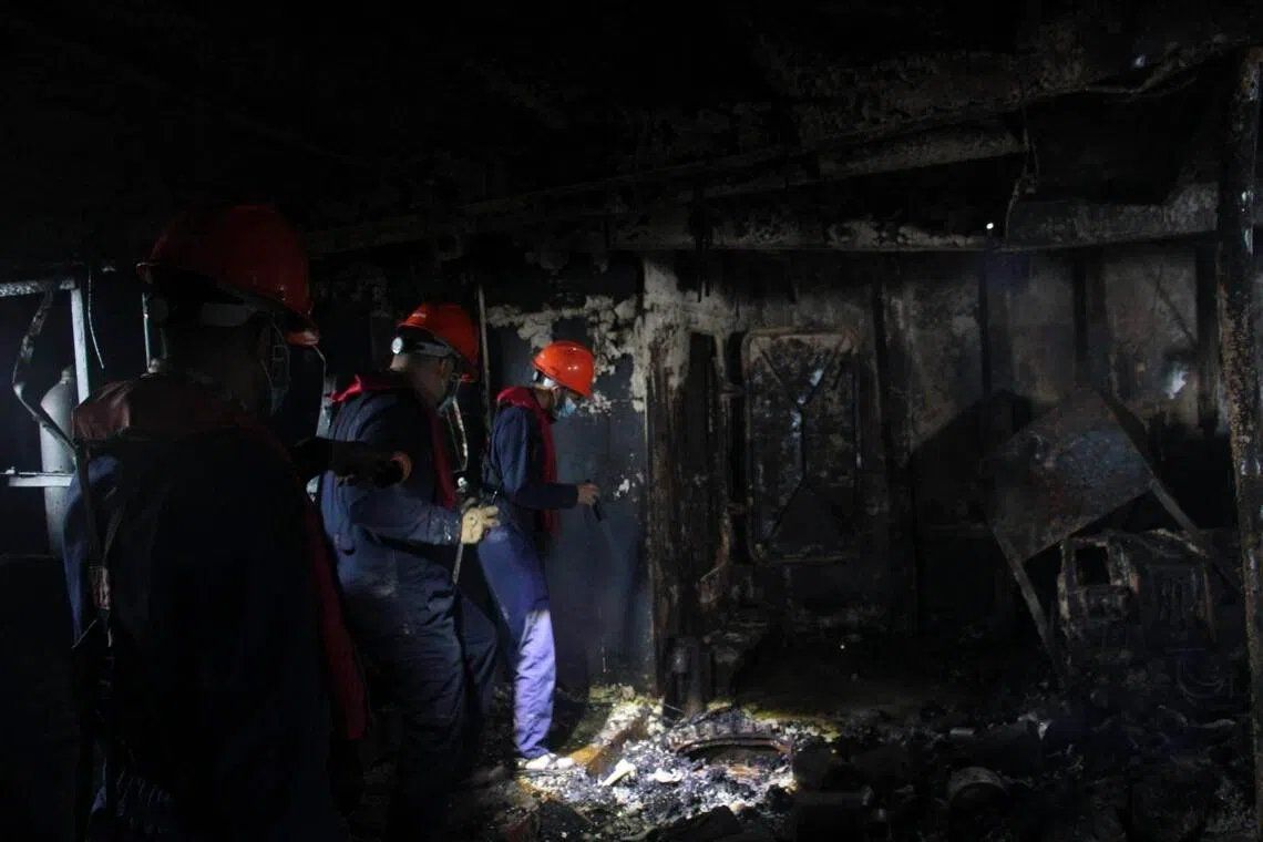 Officials said more remains could still be found, adding that “most of them are already in a charred condition”. -- PHOTO: EPA via ST/ANN