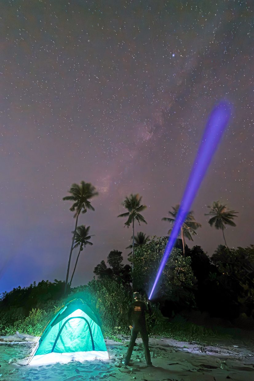 A participant observing the night sky during the meteor shower outing.