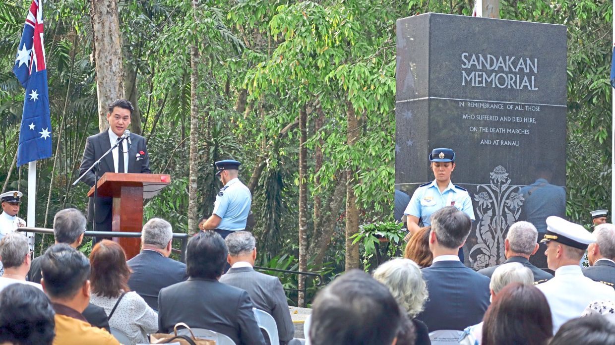 Malakun speaking at the Sandakan Memorial Day ceremony.