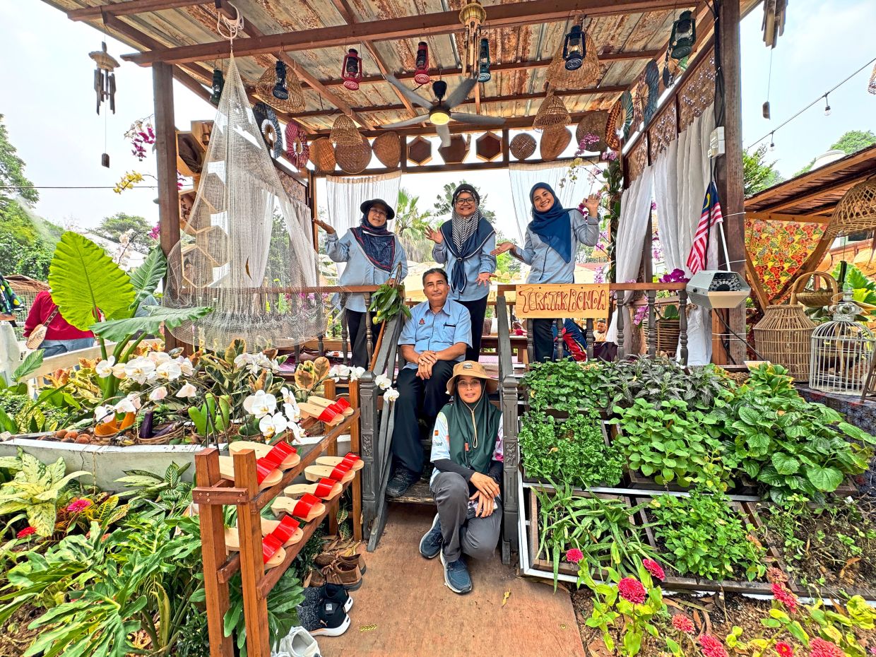 DBKL Landscape and Recreation Department director Puteri Khairul Fathiah Fahimudin (top left), Nour Sharifah (top right) with other City Hall personnel at the village hut.